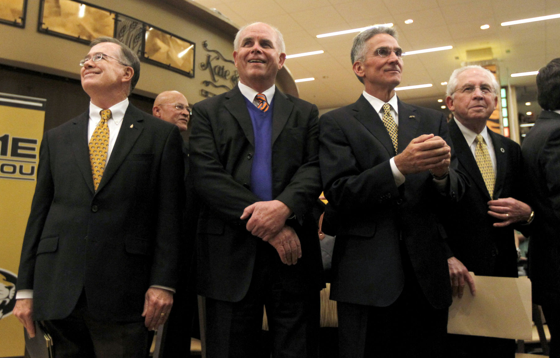 Brady Deaton, Bernie Machen, Mike Alden and Mike Slive smile